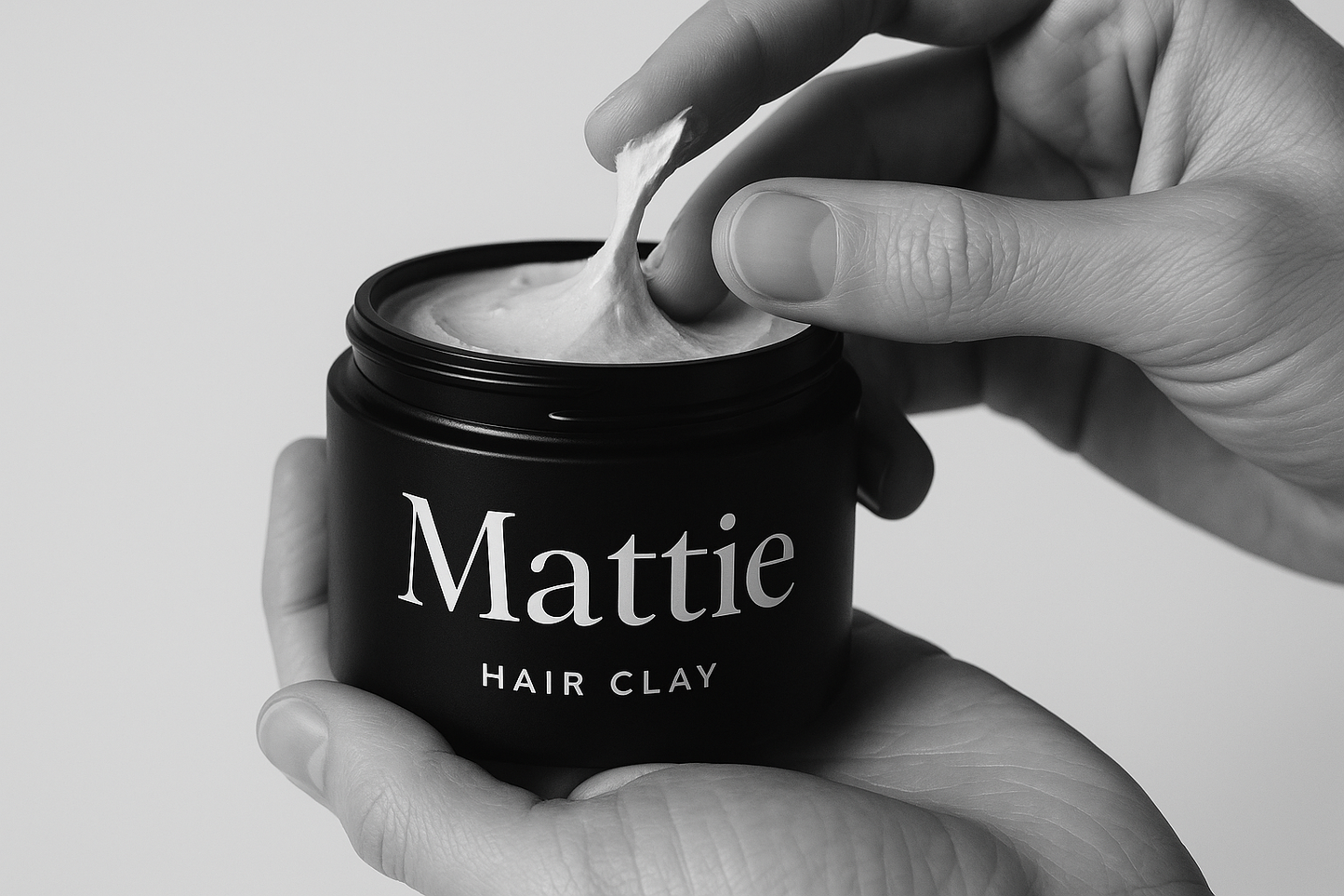 Mattie hair Clay minimal serif font white on black jar in hand being used 